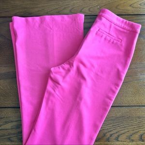 Women’s hot pink wide leg dress pants.